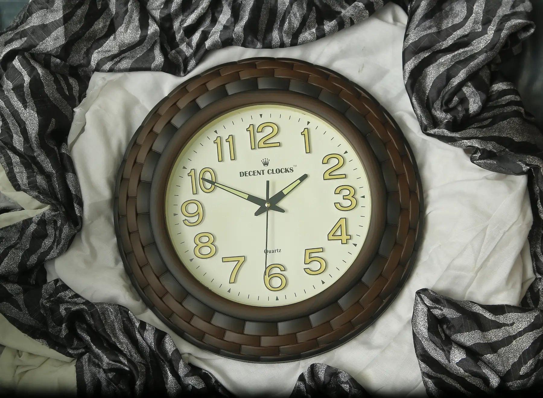 Round wall clock with wooden frame on a white surface with zebra print Featuring fabricecent Clocks wall Clocks in pakistan