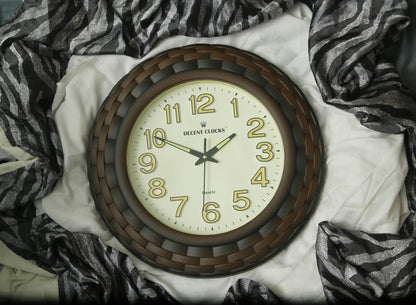 Round wall clock with wooden frame on a white surface with zebra print fabric
Cream_Brown_Glowing_wall-clock– Large 
