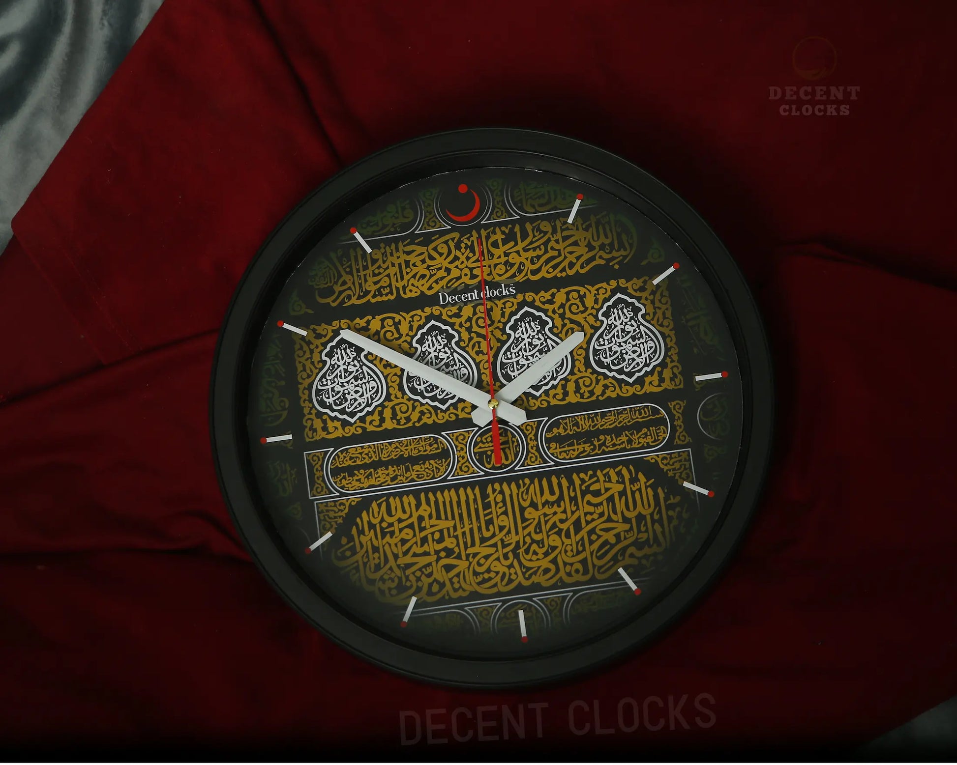 Decorative wall clock with Arabic calligraphy on a red background