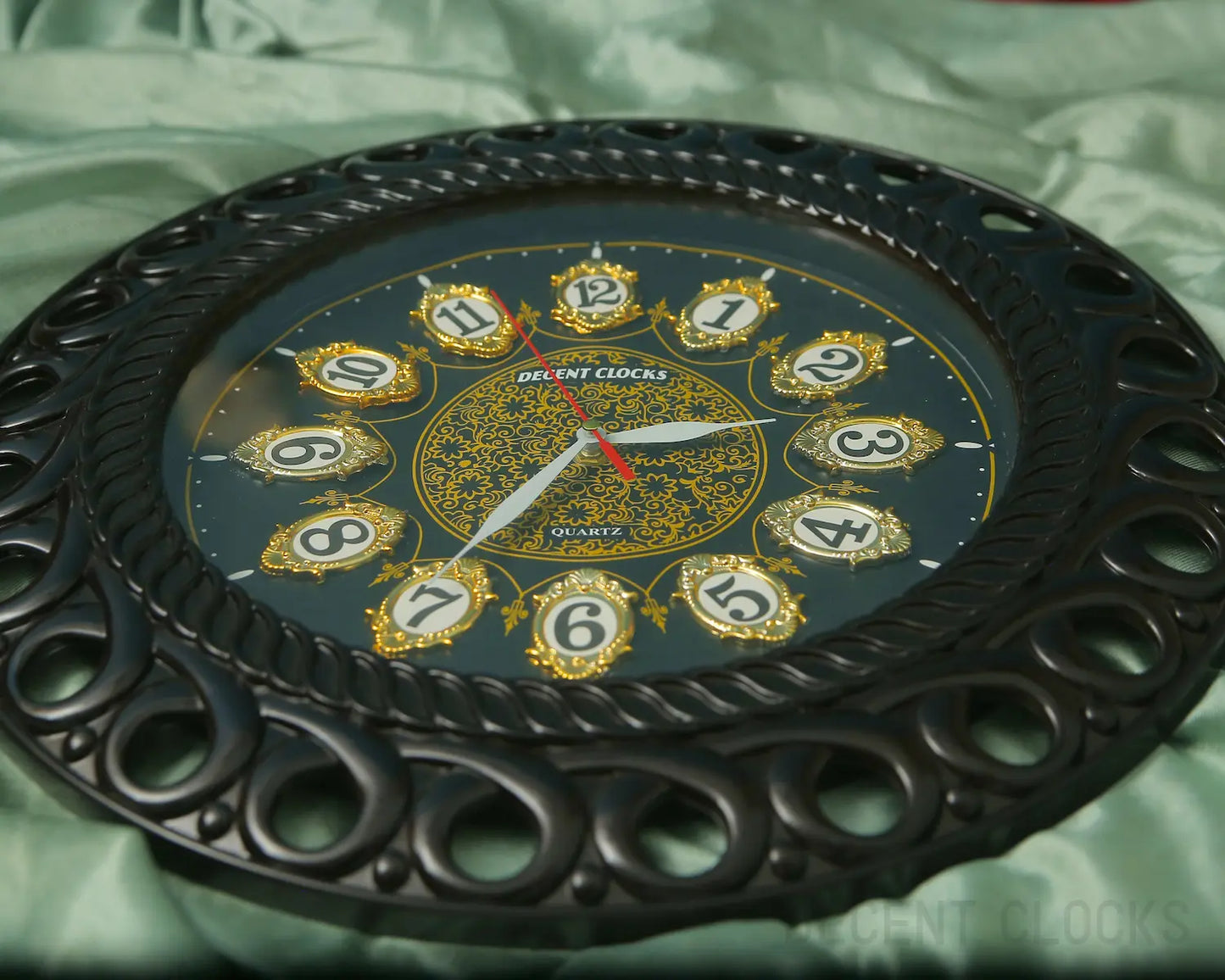 black-decorative-wall-clock-front-closeup-with light green background