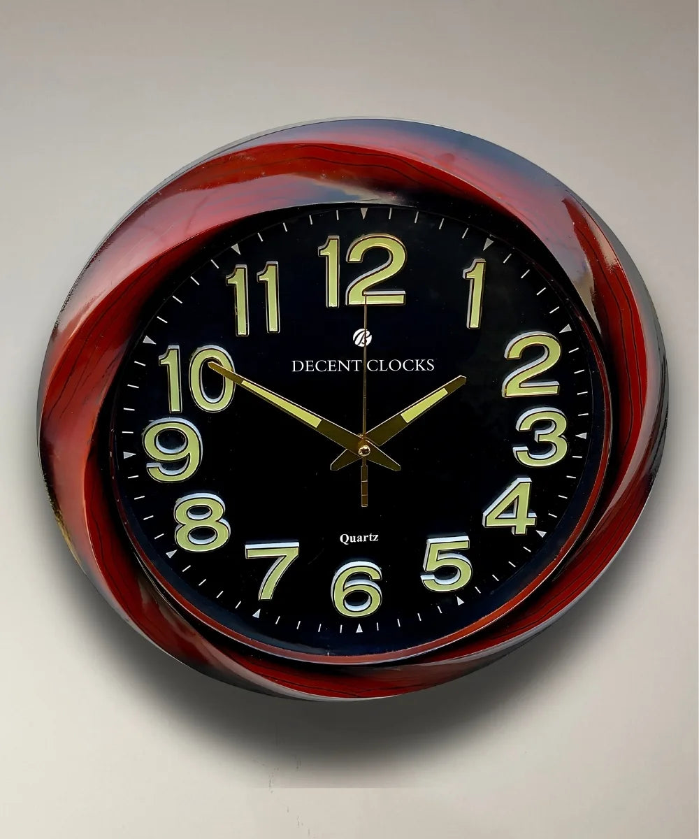 Close-up of glowing wall clock dial and golden numbers