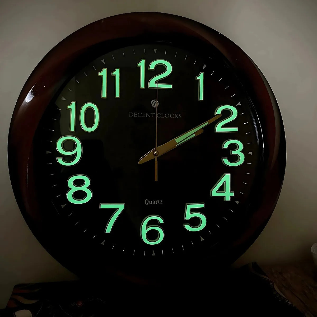 Glowing wall clock in the dark