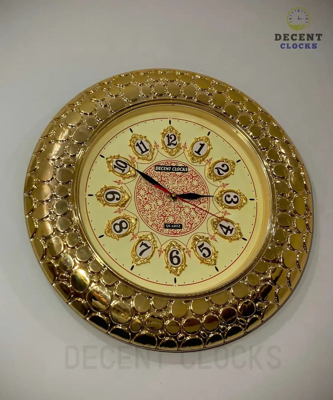 Close-up of golden fancy wall clock frame and decorative number layout