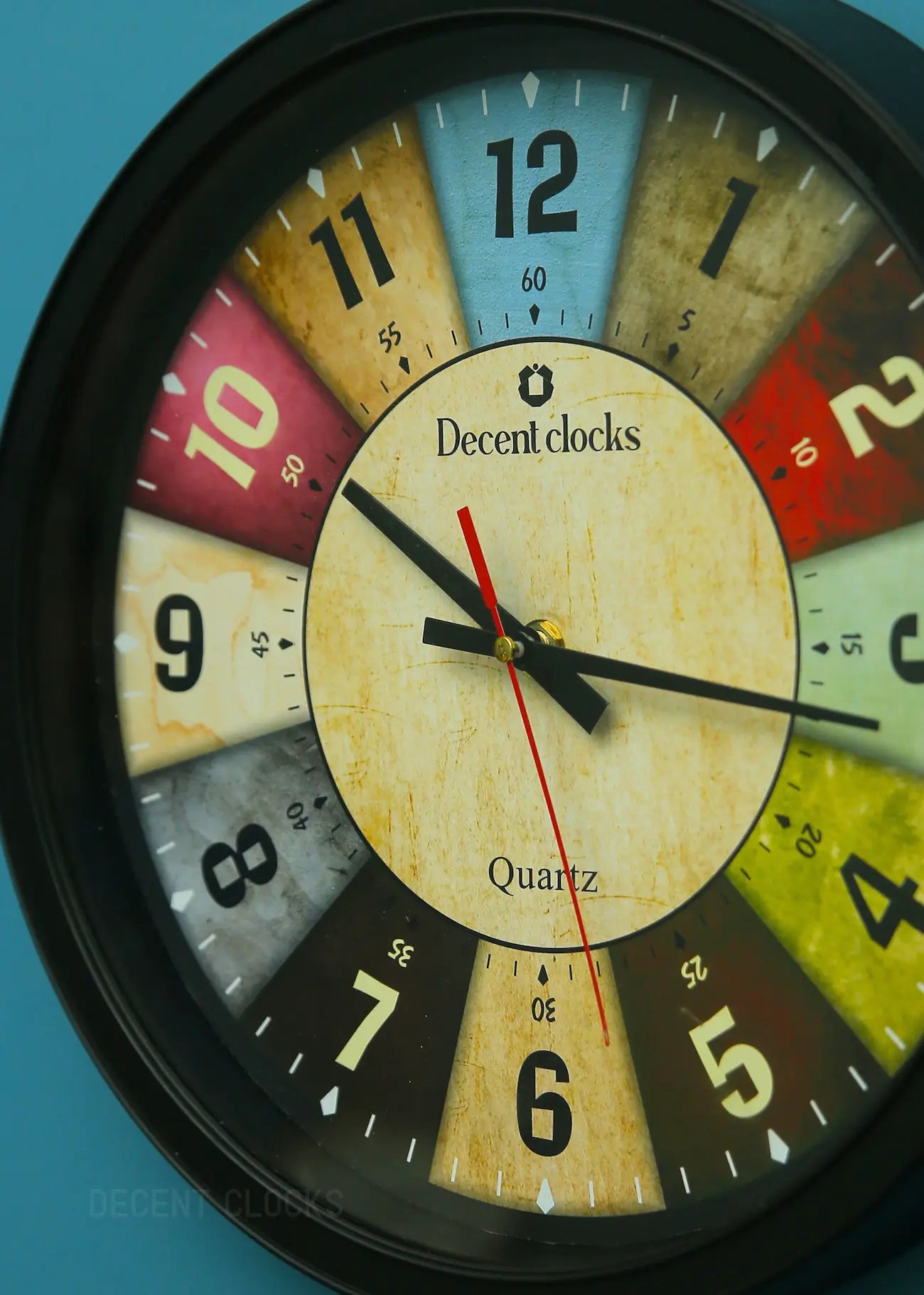 Colorful clock with 'Decent clocks' branding on a blue background