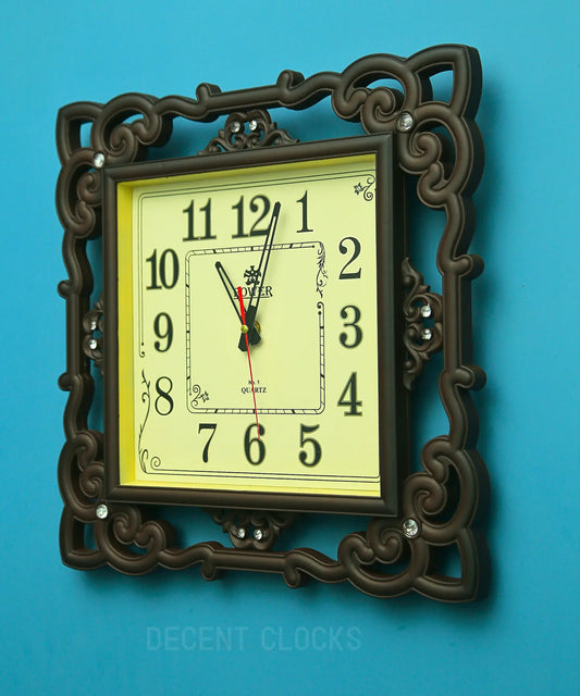 Royal Beidge square wall clock with ornate brown frame on a blue background